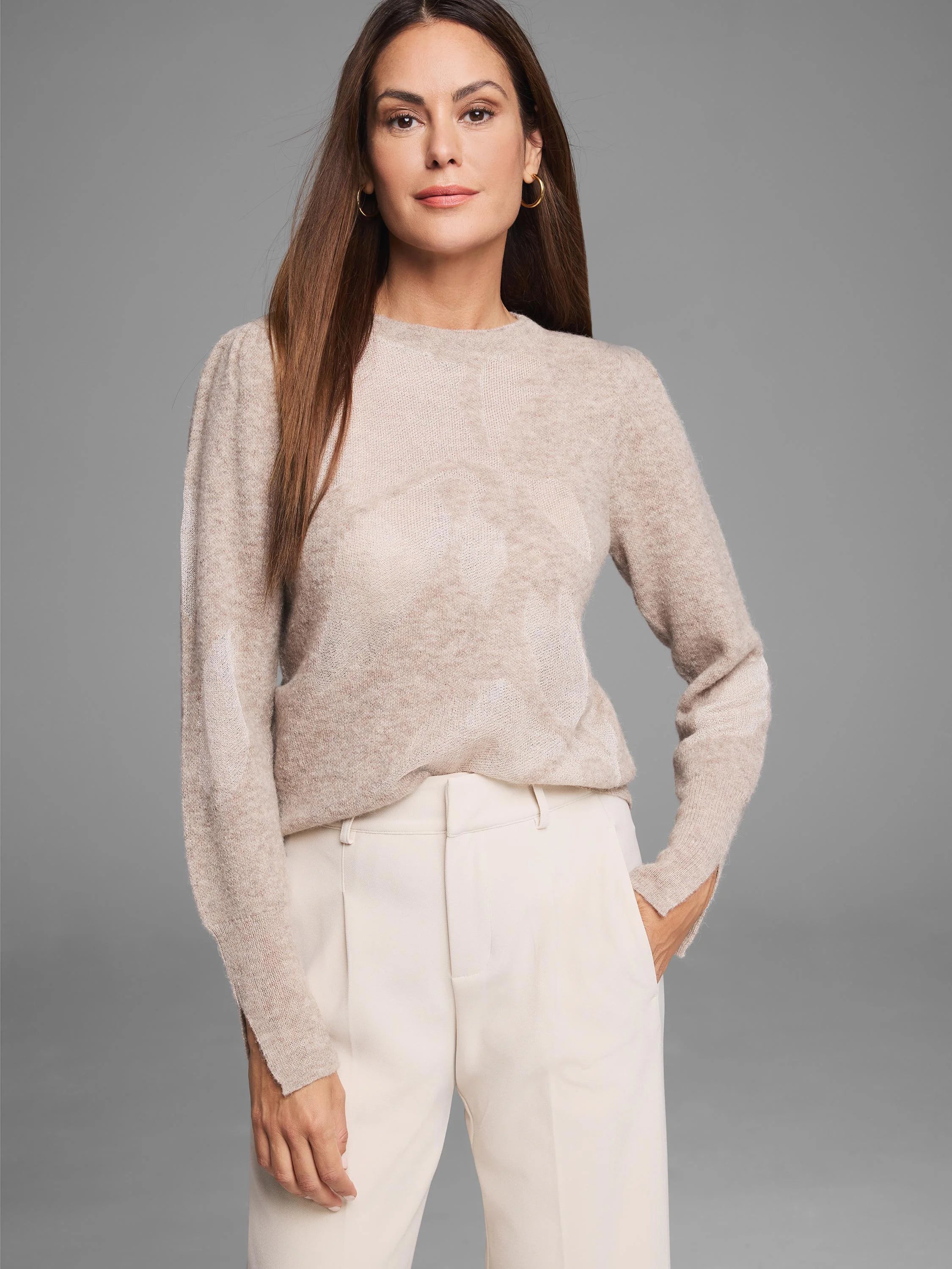 Light beige lace knit floral sweater with a subtle floral pattern, crew neck, and long sleeves.