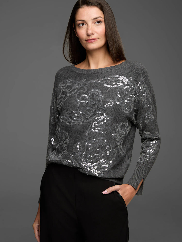 Dark gray sweater with silver sequin floral patterns on the front and sleeves. Round neck.