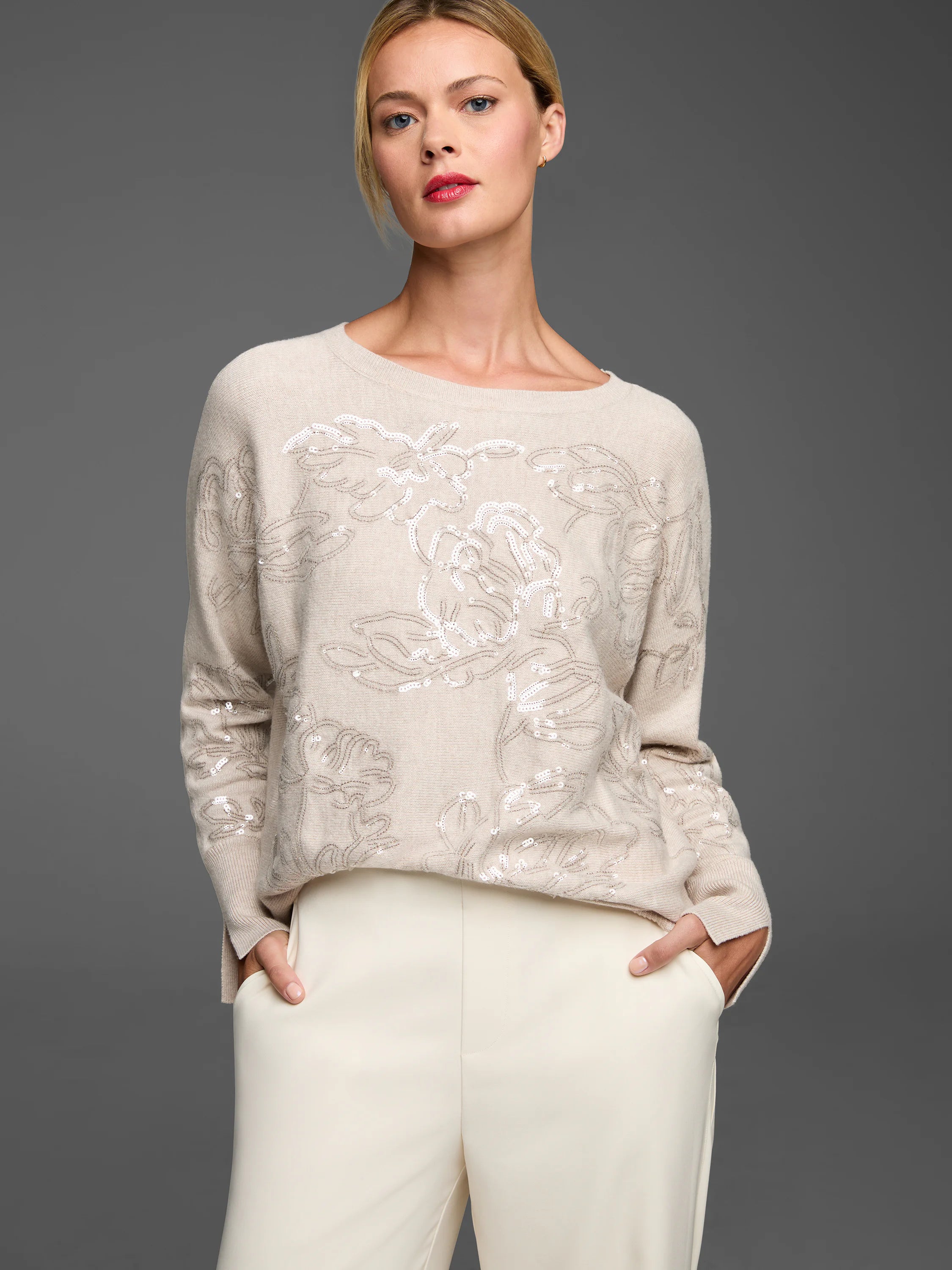 Light beige sweater with an all-over floral design made of shimmering white sequins.