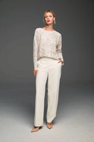 Light beige relaxed sweater with all-over sequin pattern.