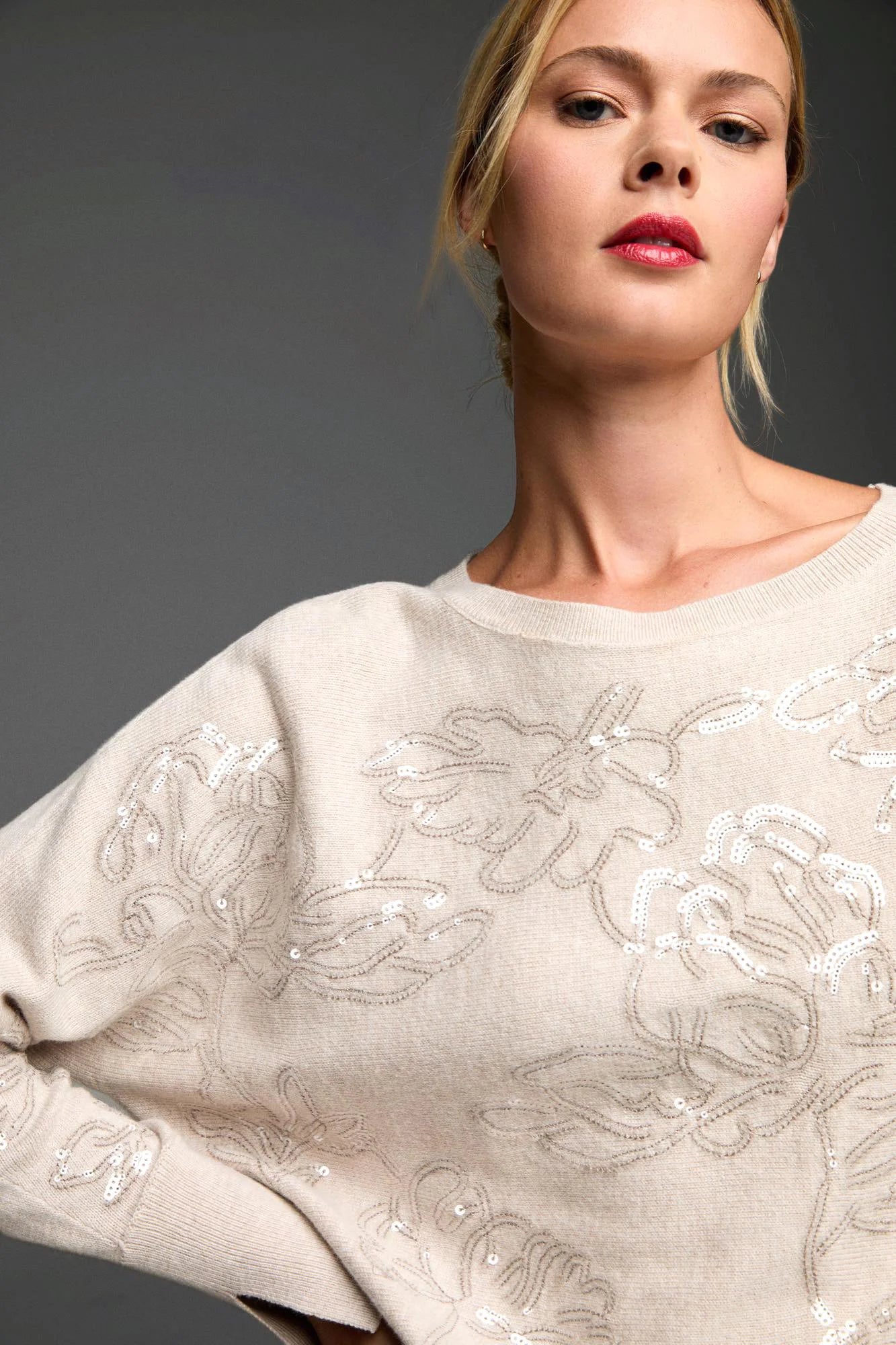 Oatmeal crew neck sweater features an all-over taupe embroidered floral pattern detailed with white sequins.