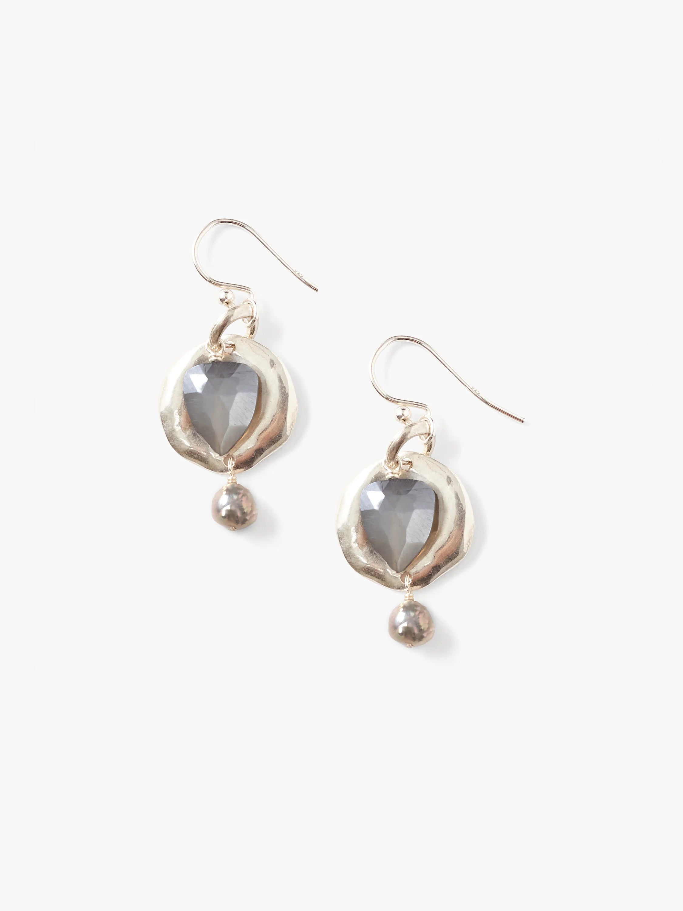 Pair of silver-toned drop earrings. Each has an organic silver disc with a faceted grey stone and a grey pearl dangle.