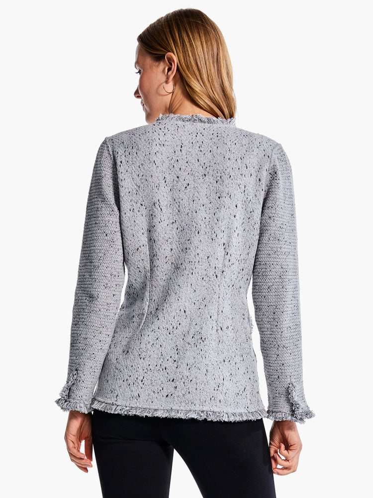 Gray knit blazer with black flecks. Features a frayed hem and cuffs. Long sleeves.