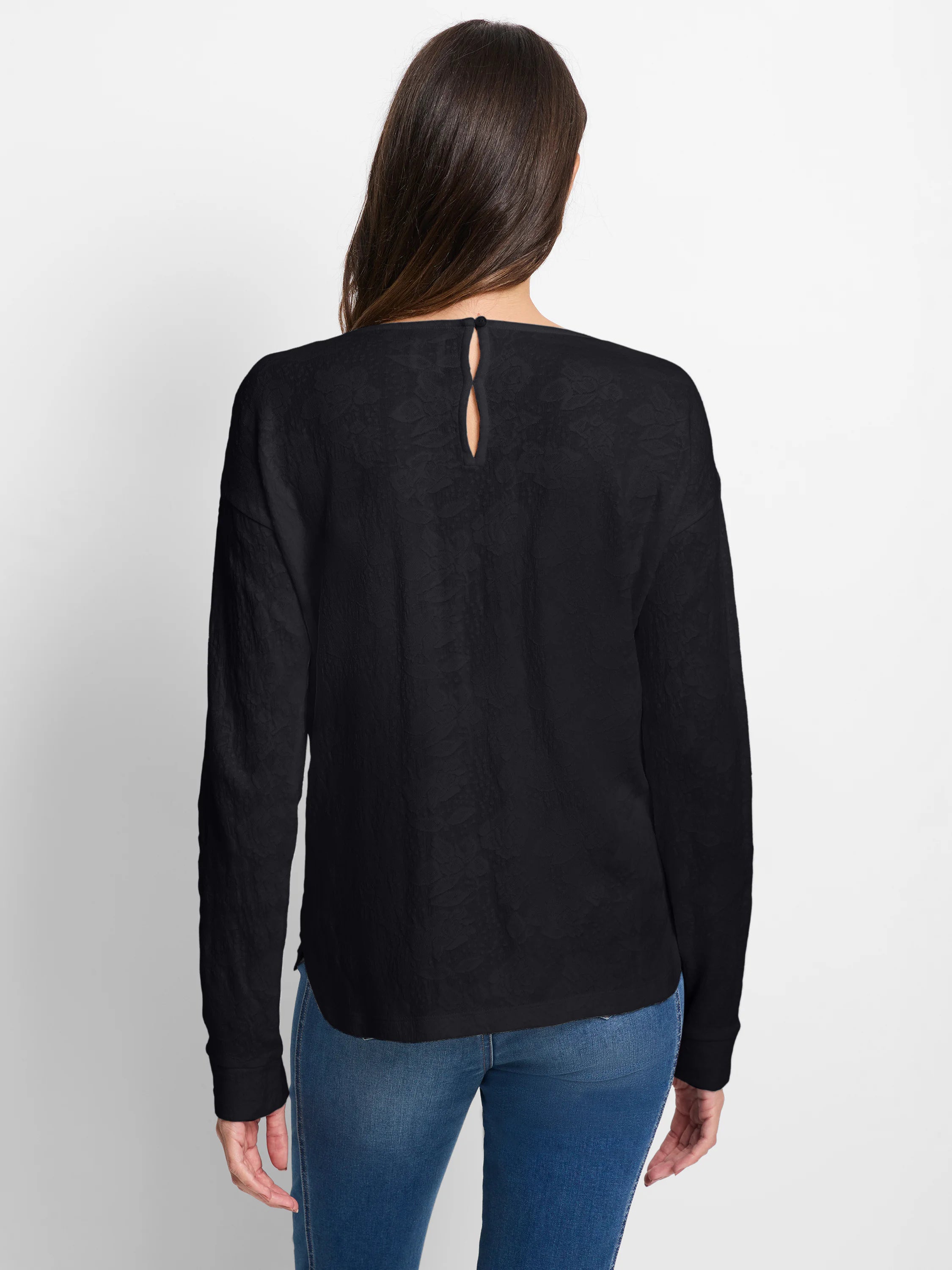 Black Easy Fit Lace Knit Tee, back view. Subtle raised lace pattern, long sleeves, keyhole button closure at neck.