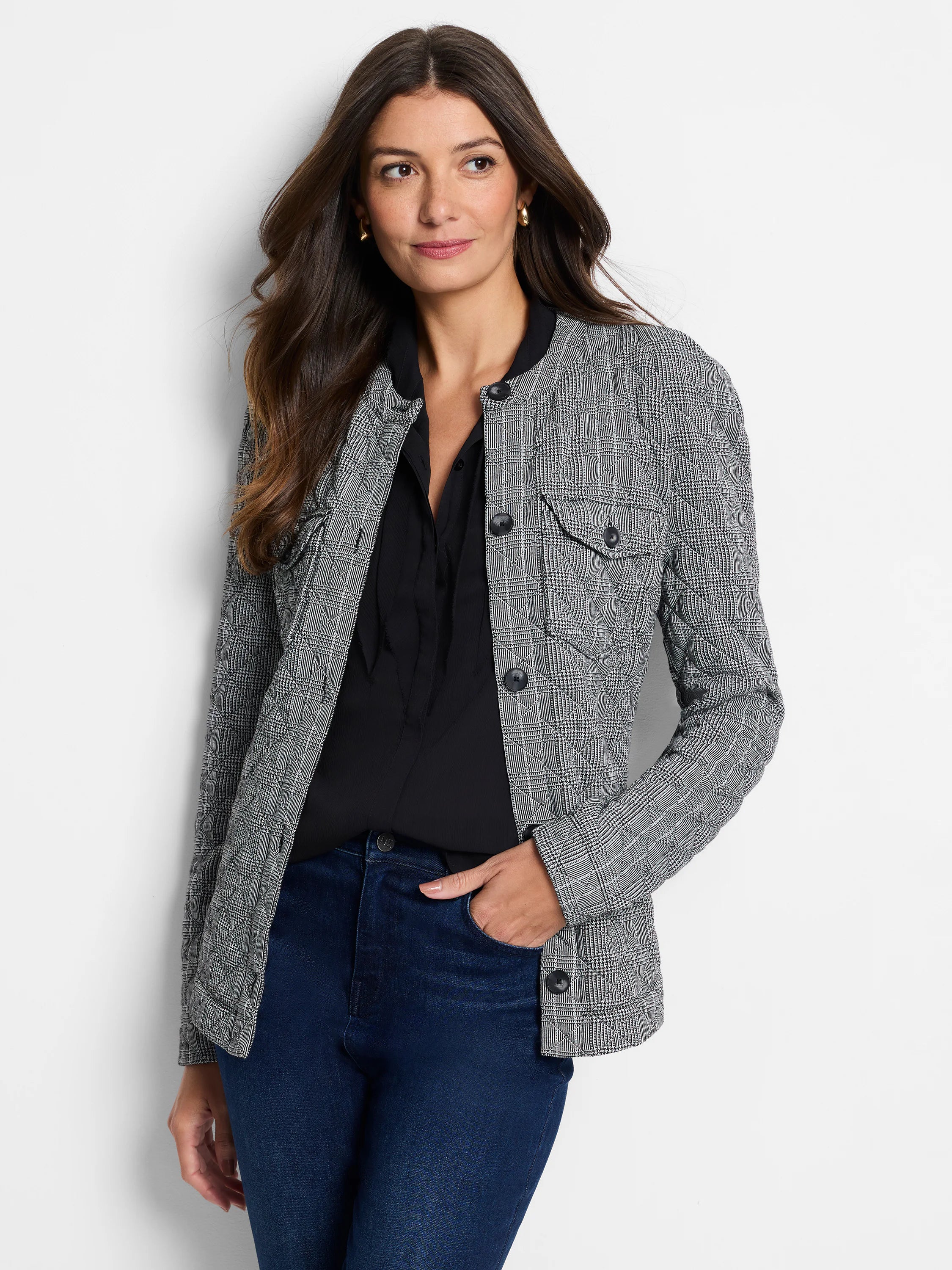 Quilted black and white plaid jacket with a band collar, button front, and two chest pockets.