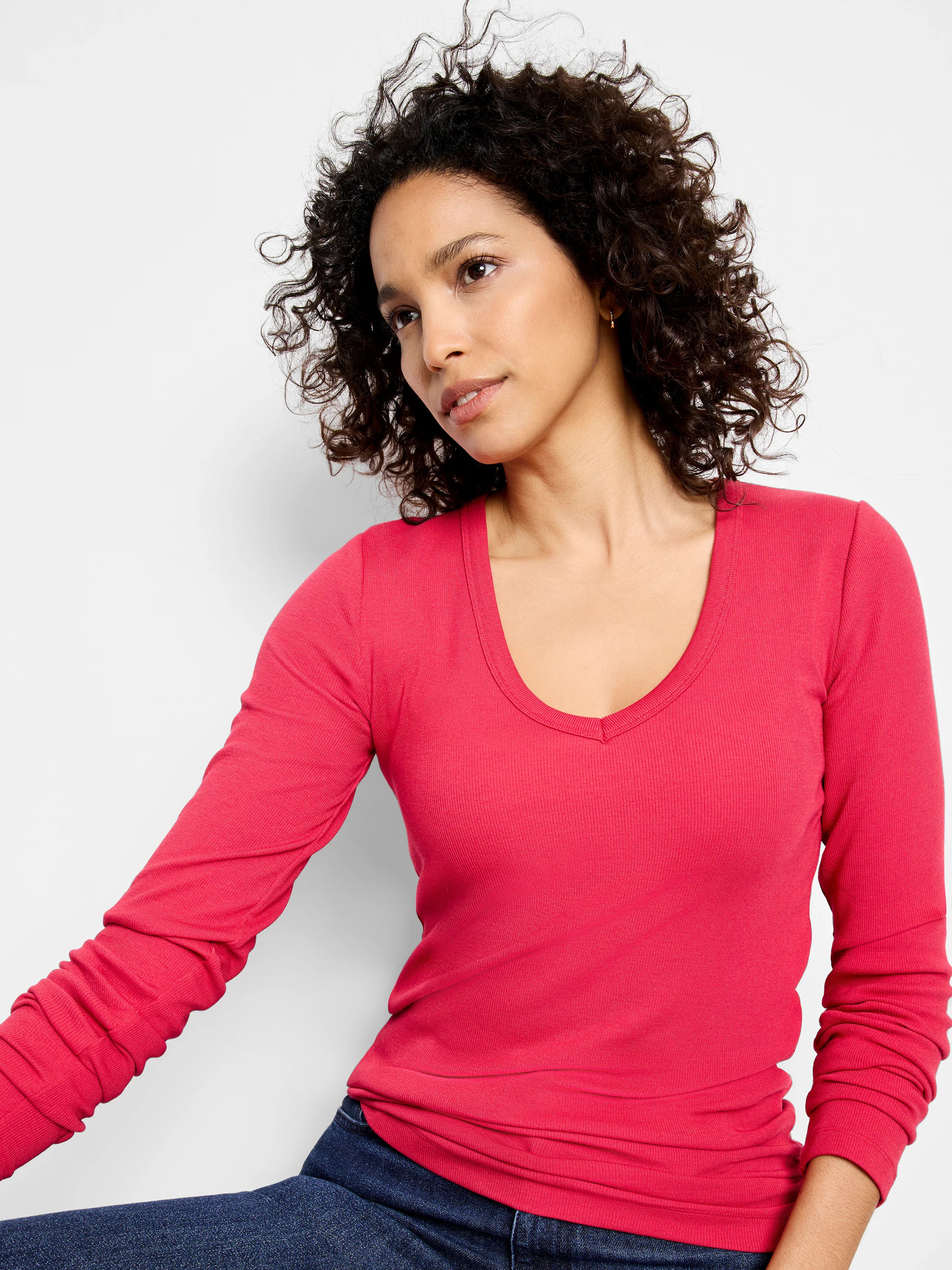 Fuchsia ribbed long sleeve V-neck tee, form-fitting.