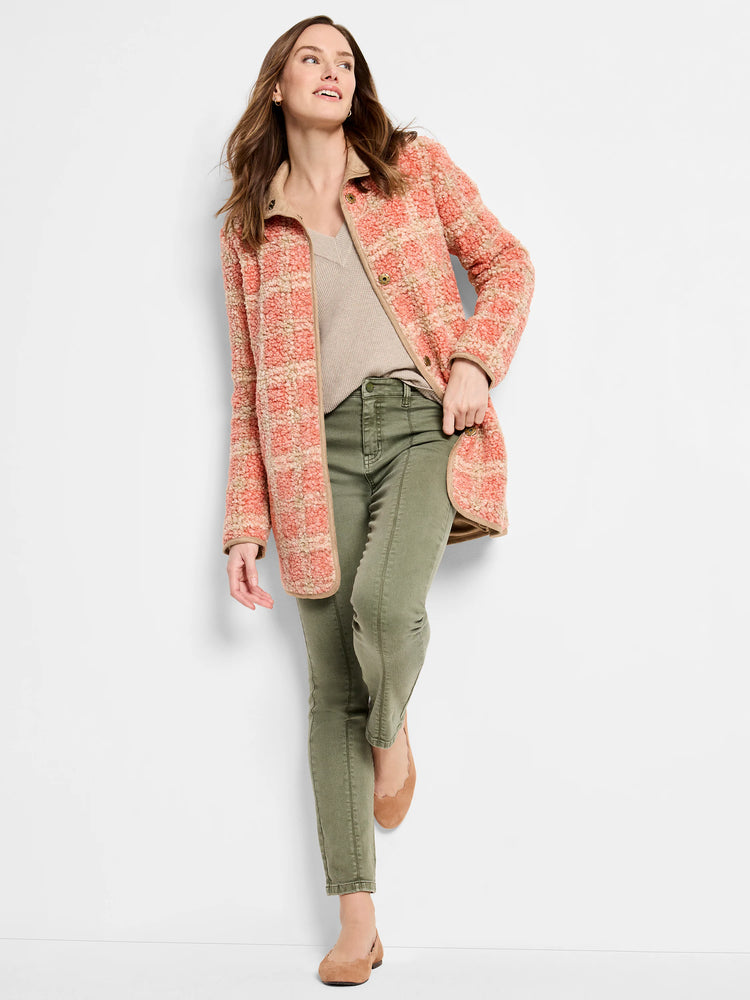 Coral and cream textured sherpa jacket with a diffused block pattern. Features tan trim, collar, and brass-tone buttons.