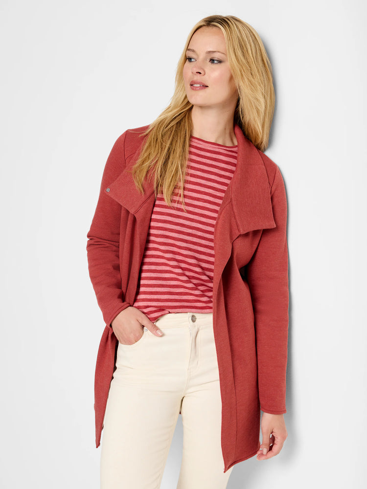 Rust-colored knit open-front jacket with a wide, drapey collar and a snap detail on the lapel. Falls mid-thigh.