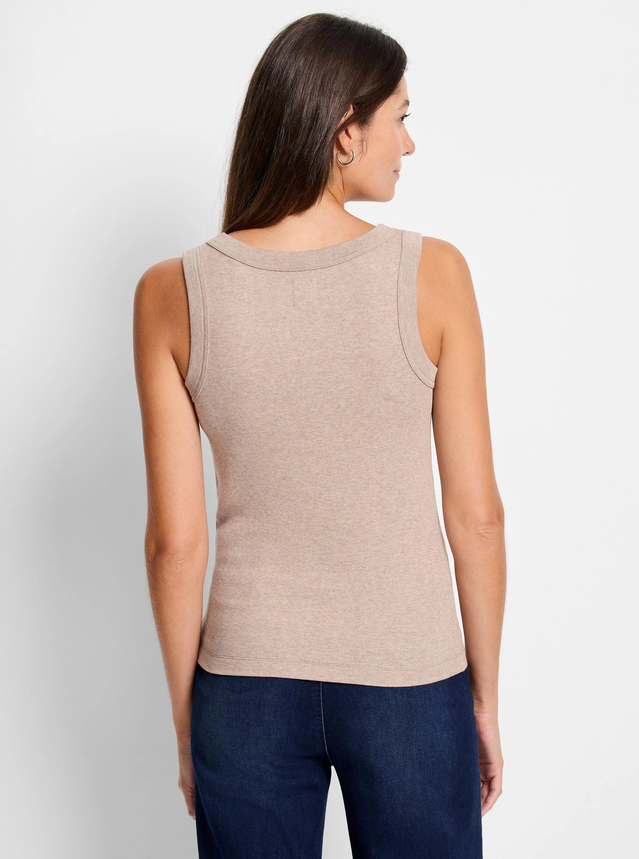 Back view of a tan, ribbed knit scoop tank top worn by a model.