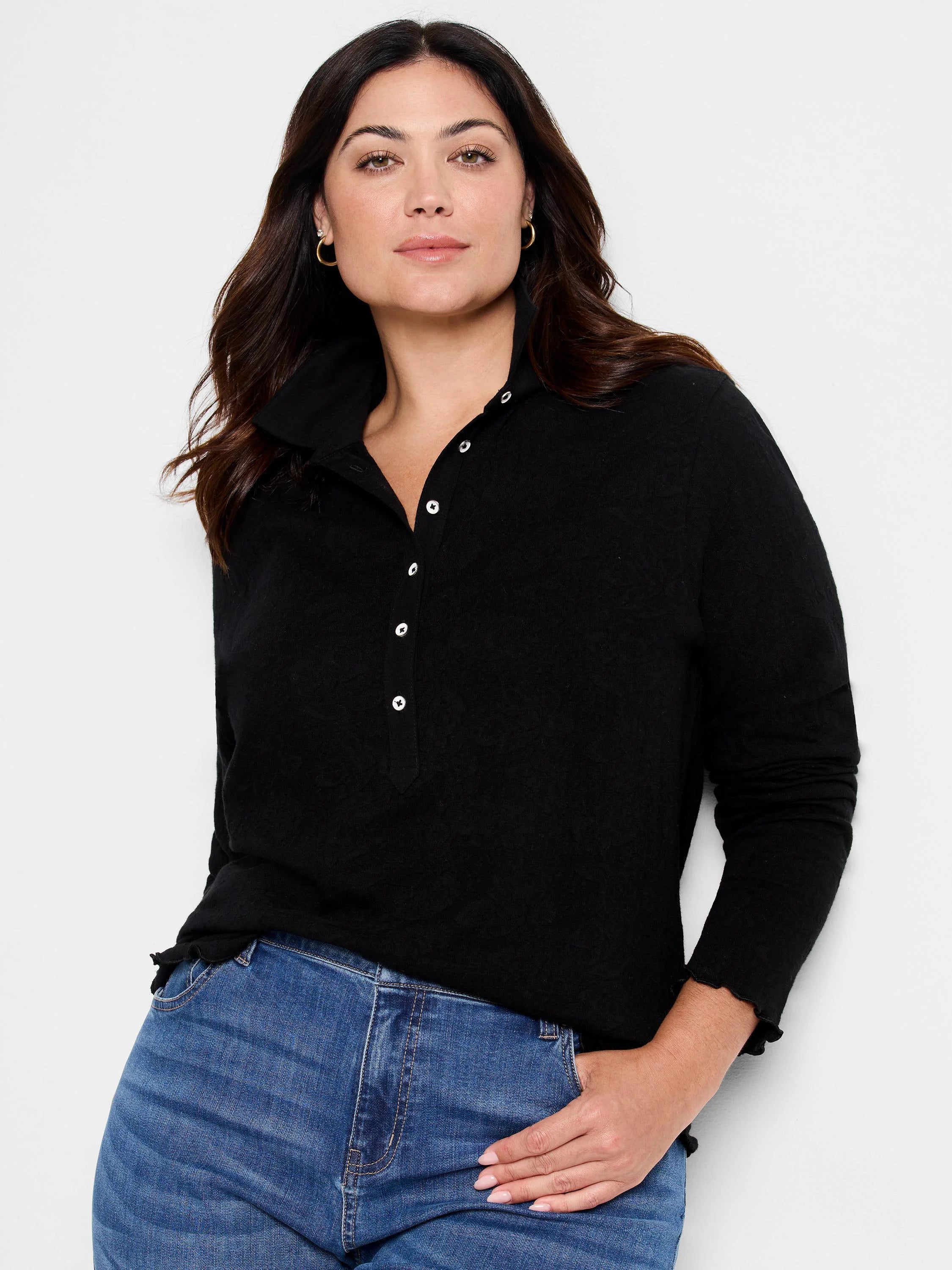 Black lace knit collared top with white buttons down the placket and ruffled cuffs.