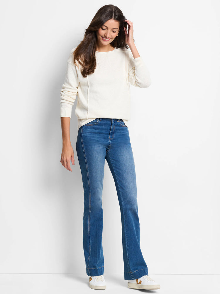 Cream long-sleeve sweater featuring prominent vertical seams down the front and ribbed cuffs.