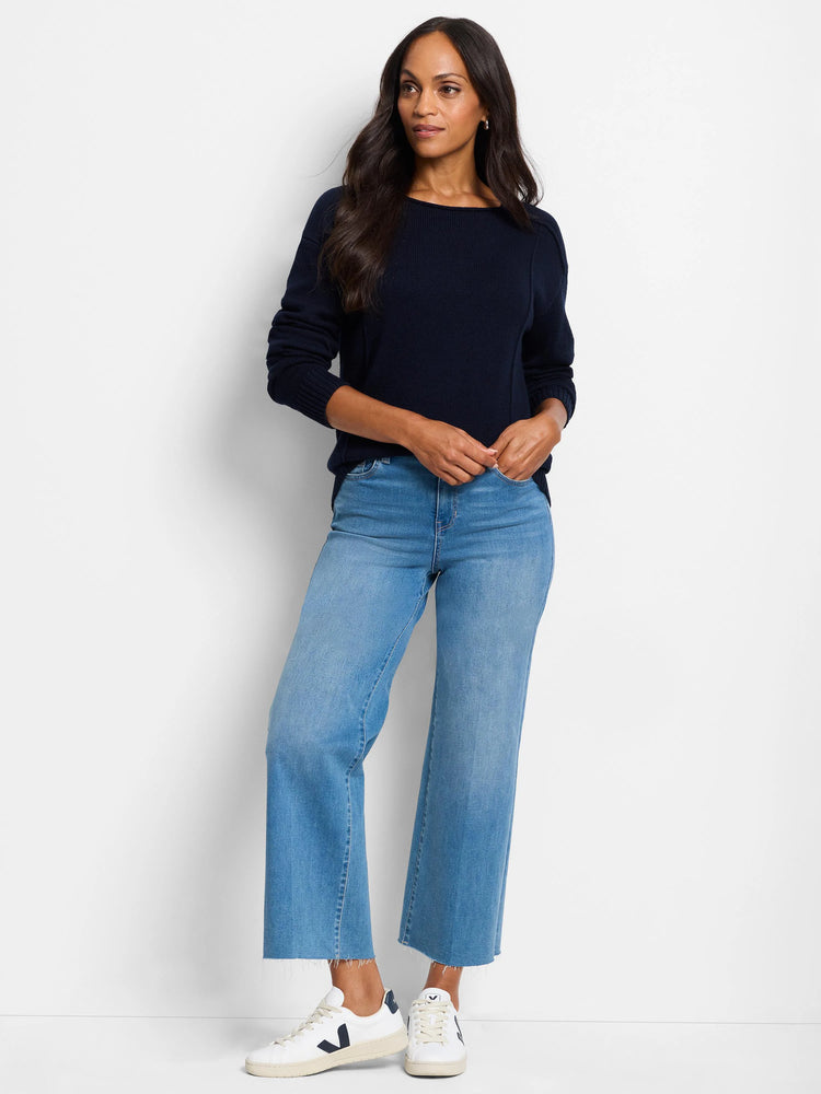 Navy boat neck sweater with visible vertical seams down the front and along sleeves. Features ribbed cuffs and hem.
