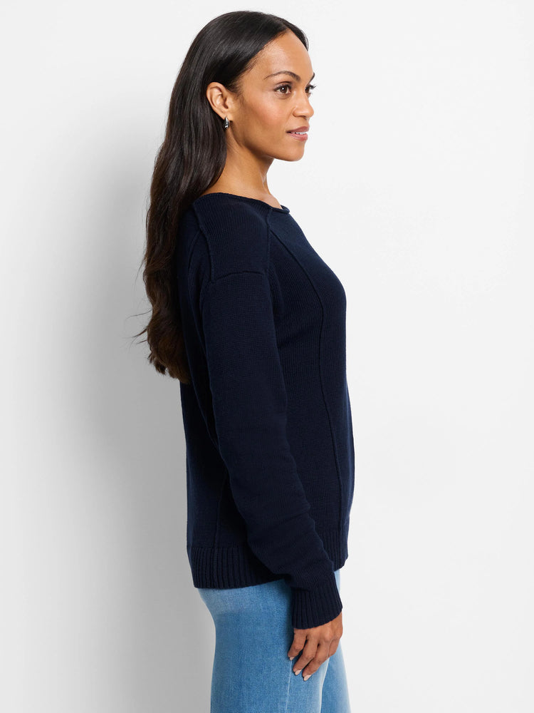 Navy blue knit sweater with prominent vertical seams and a boat neck.