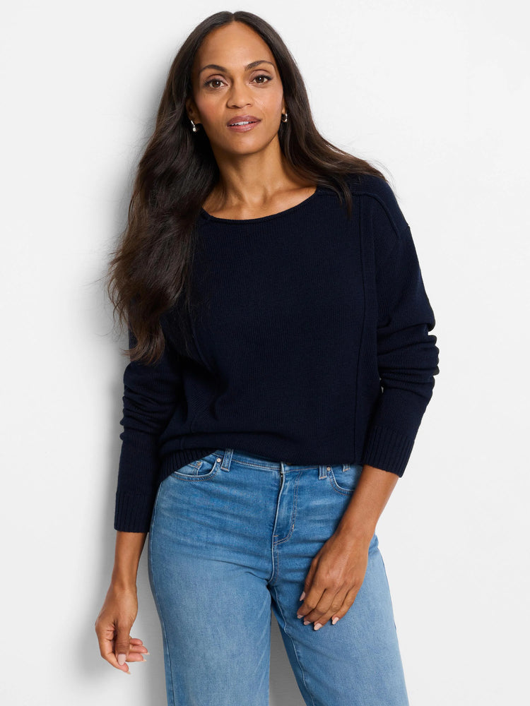 Navy knit sweater with a boat neck, ribbed cuffs and hem, and vertical seam details on the front.