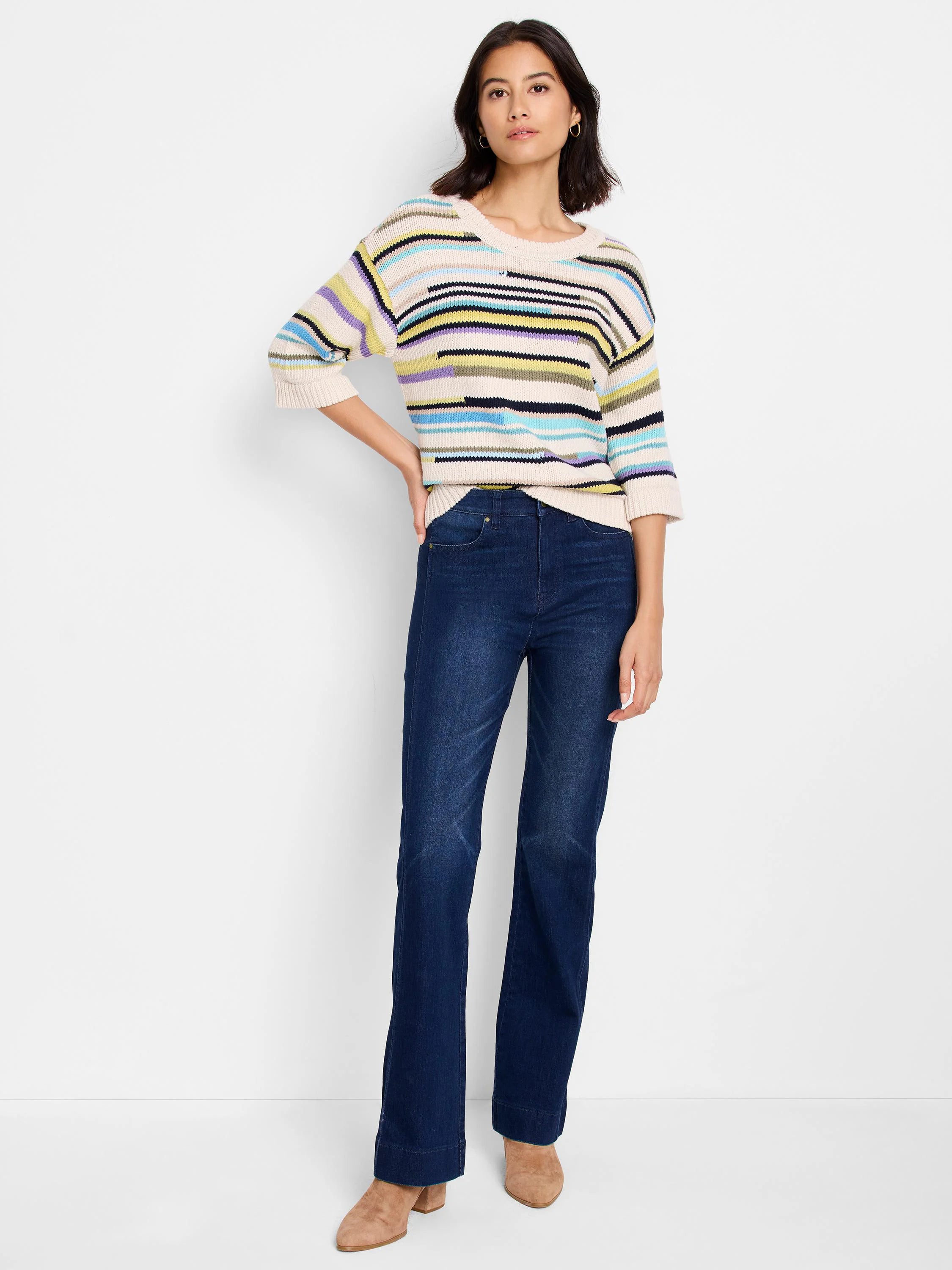 Cream sweater with varied horizontal stripes: light blue, purple, yellow, black, and beige-green. Three-quarter sleeves.