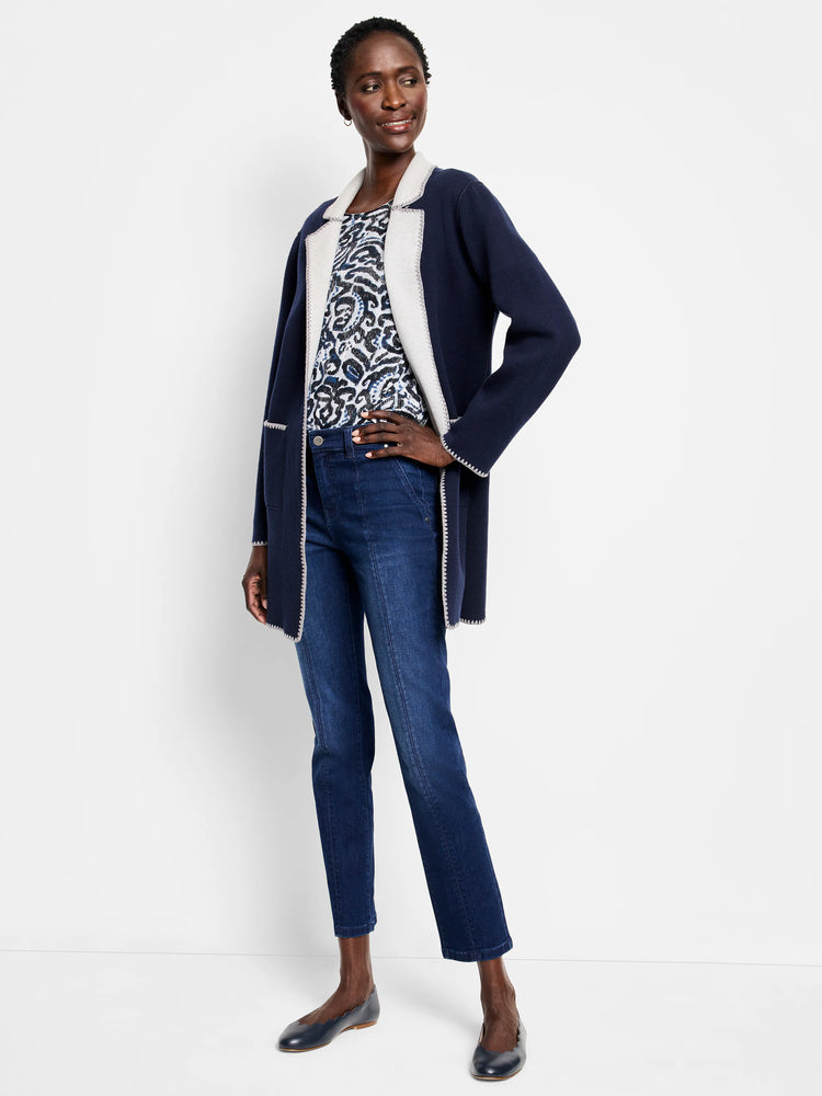 Navy knit jacket with light gray trim and zigzag stitching.