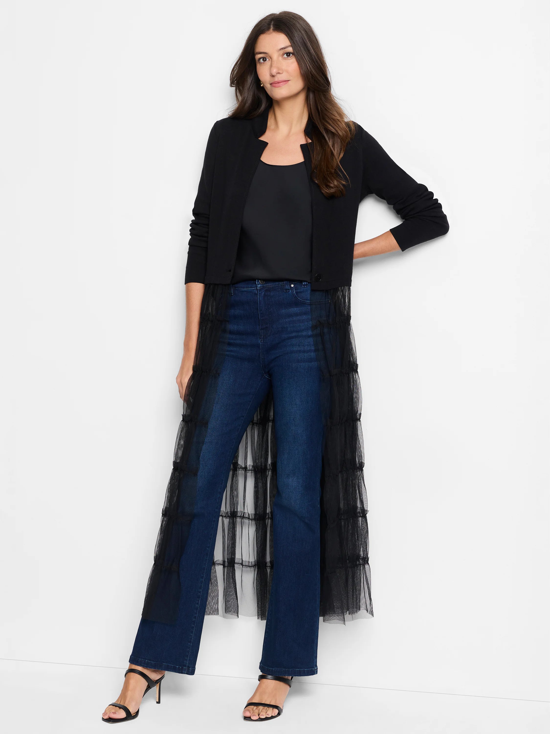 Black knit jacket. Cropped, open front with a stand collar and V-split neckline.