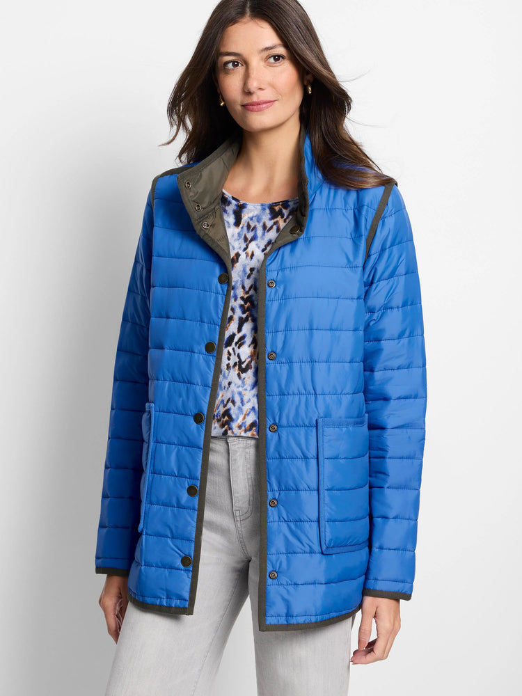 Blue quilted puffer jacket with dark olive green trim, snap buttons, and patch pockets.