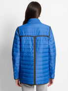 Back of a bright blue horizontally quilted jacket with dark grey trim on shoulders, T-shaped back, cuffs, and hem.