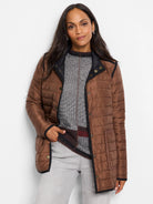 Reversible brown quilted puffer jacket with black trim and gold snap buttons.