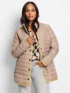 Beige quilted puffer jacket with lime green trim on edges & collar. Snap button closure.