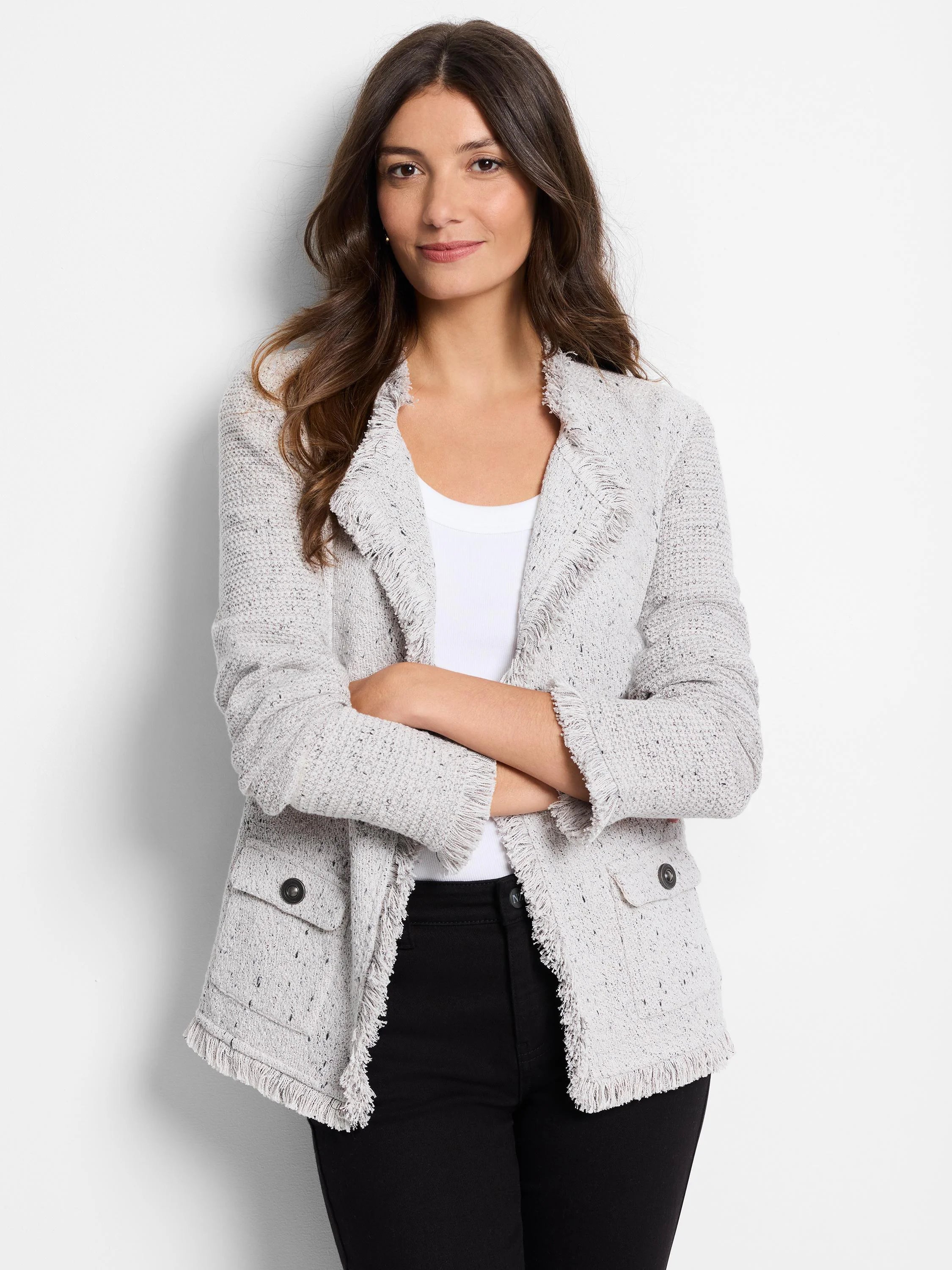Speckled light gray knit jacket with fringe on lapels, cuffs, & hem. Two front patch pockets with dark buttons.