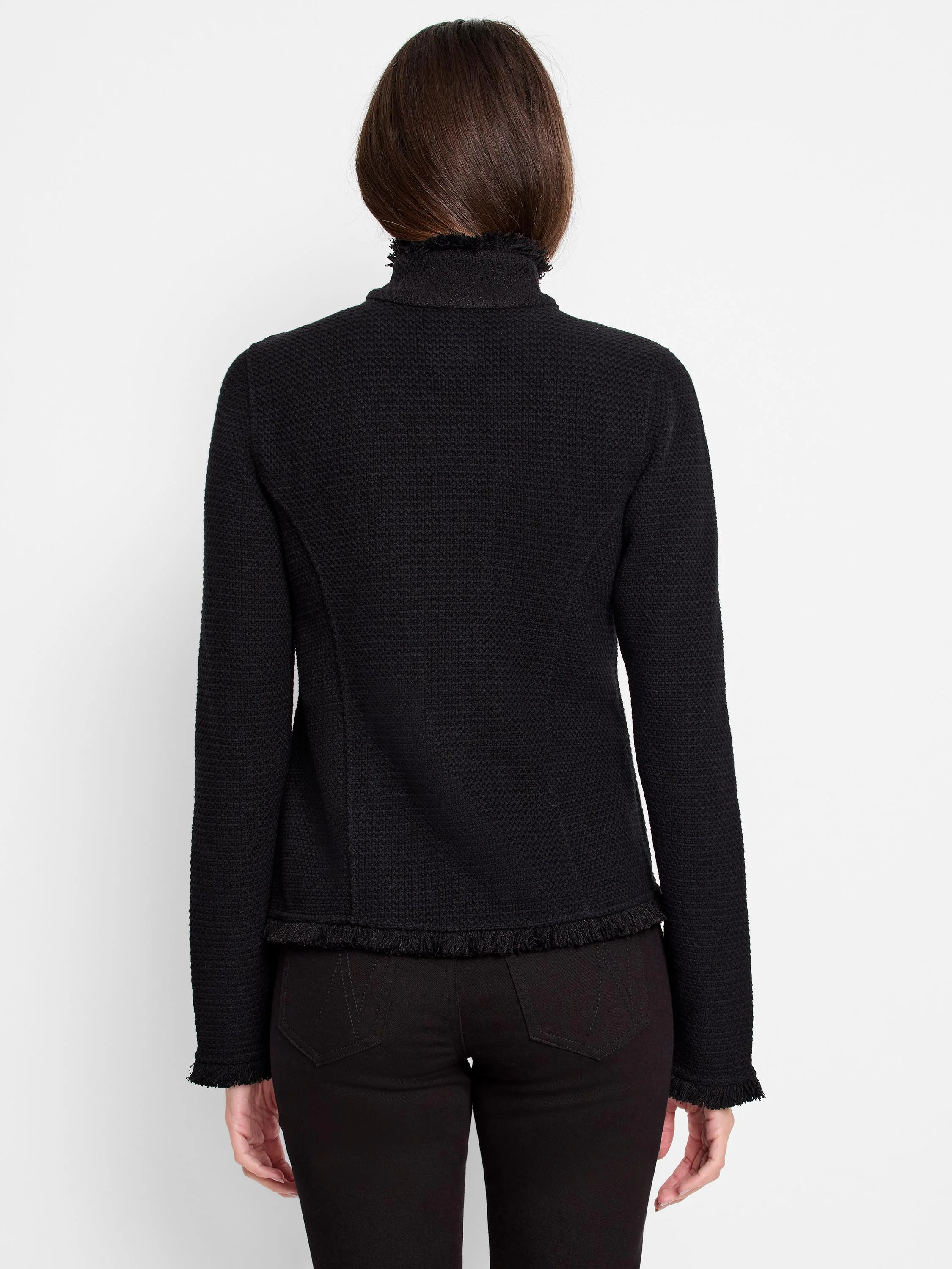 Black textured knit jacket with stand-up collar and fringe trim at the neck, hem, and cuffs. Rear view.