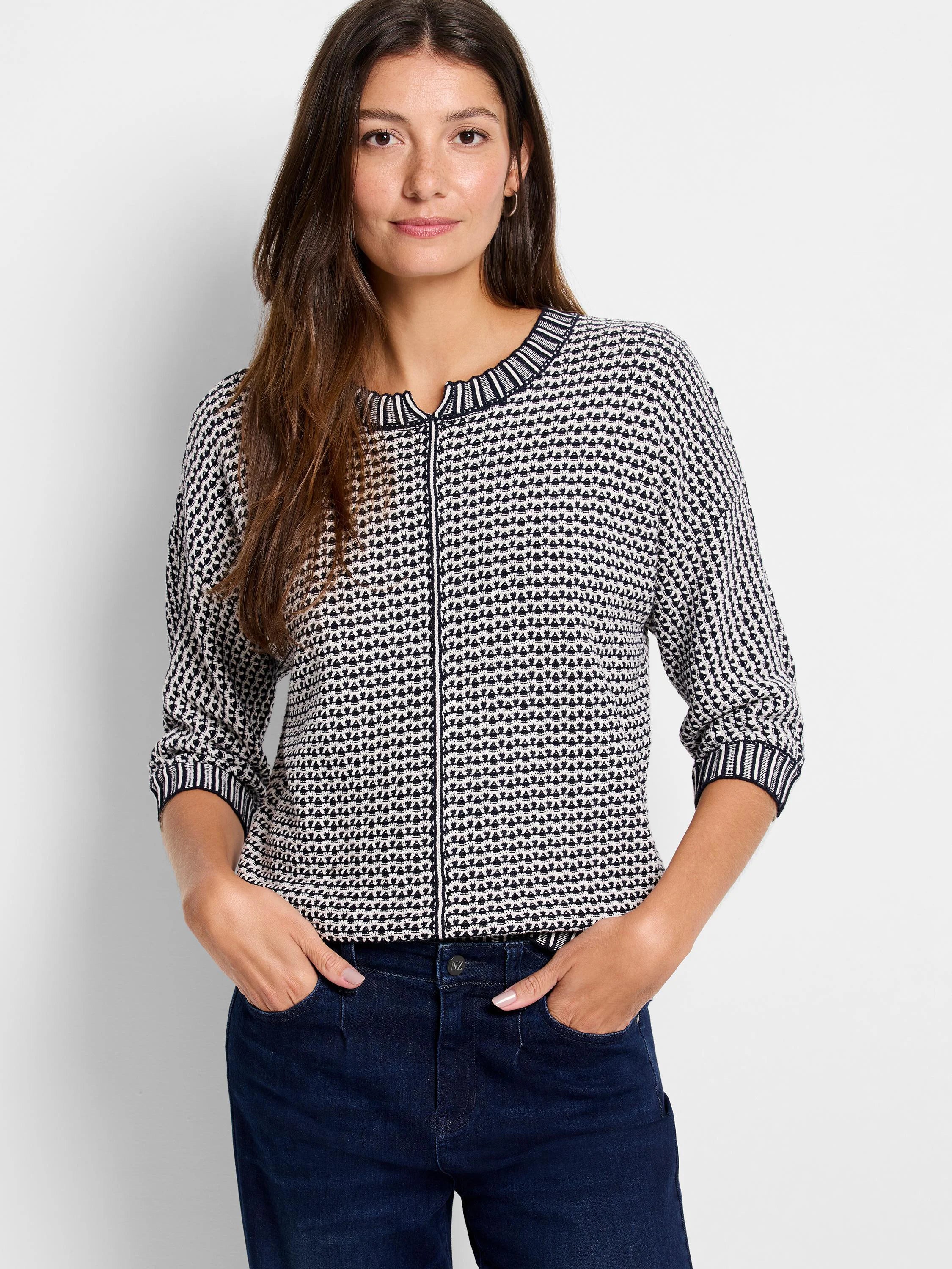 Black & off-white geometric tuck stitch sweater with ribbed V-split neckline, center placket, and striped 3/4 cuffs.