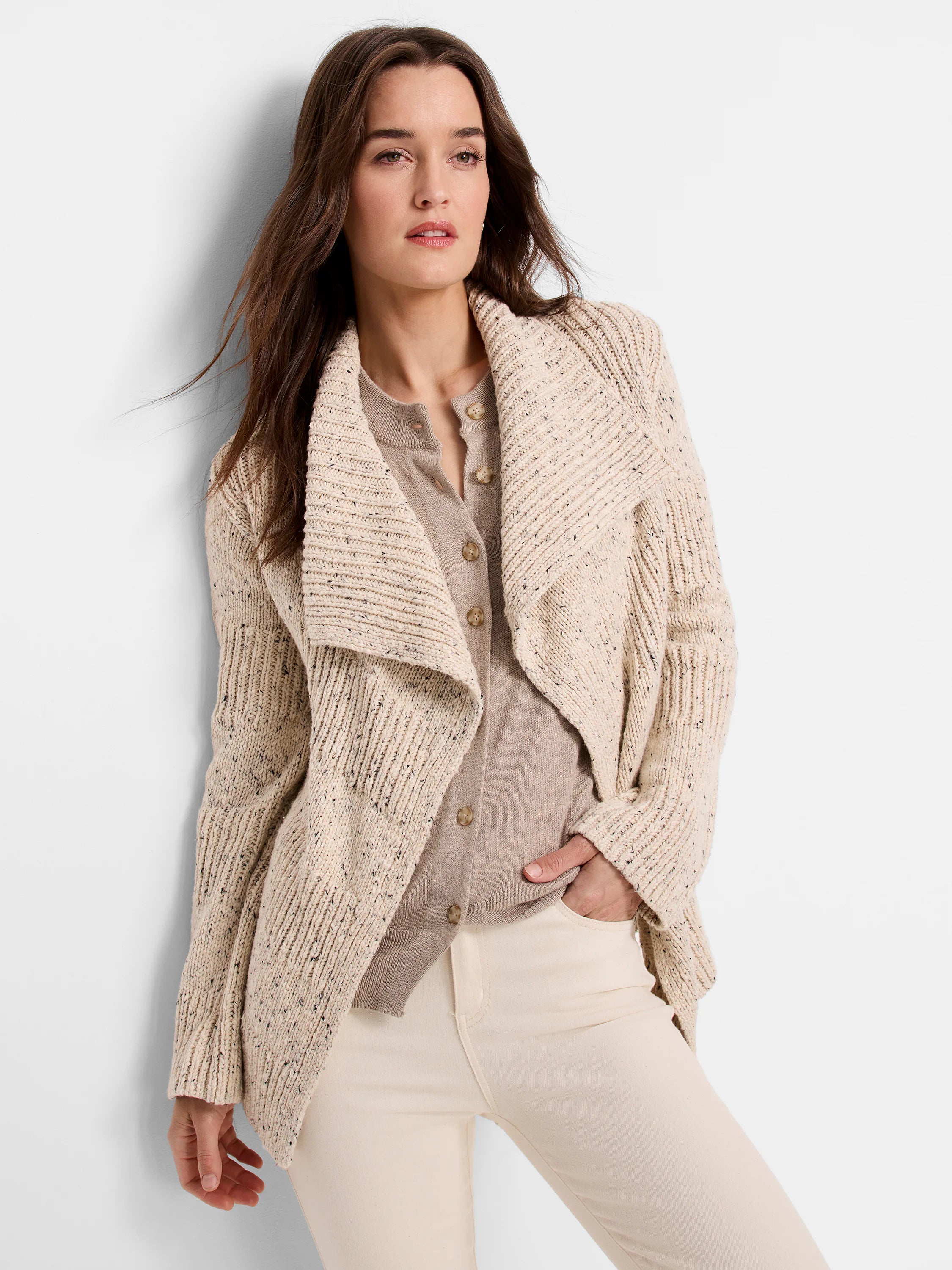 Beige speckled tweed cardigan with a ribbed knit and a draped shawl collar.