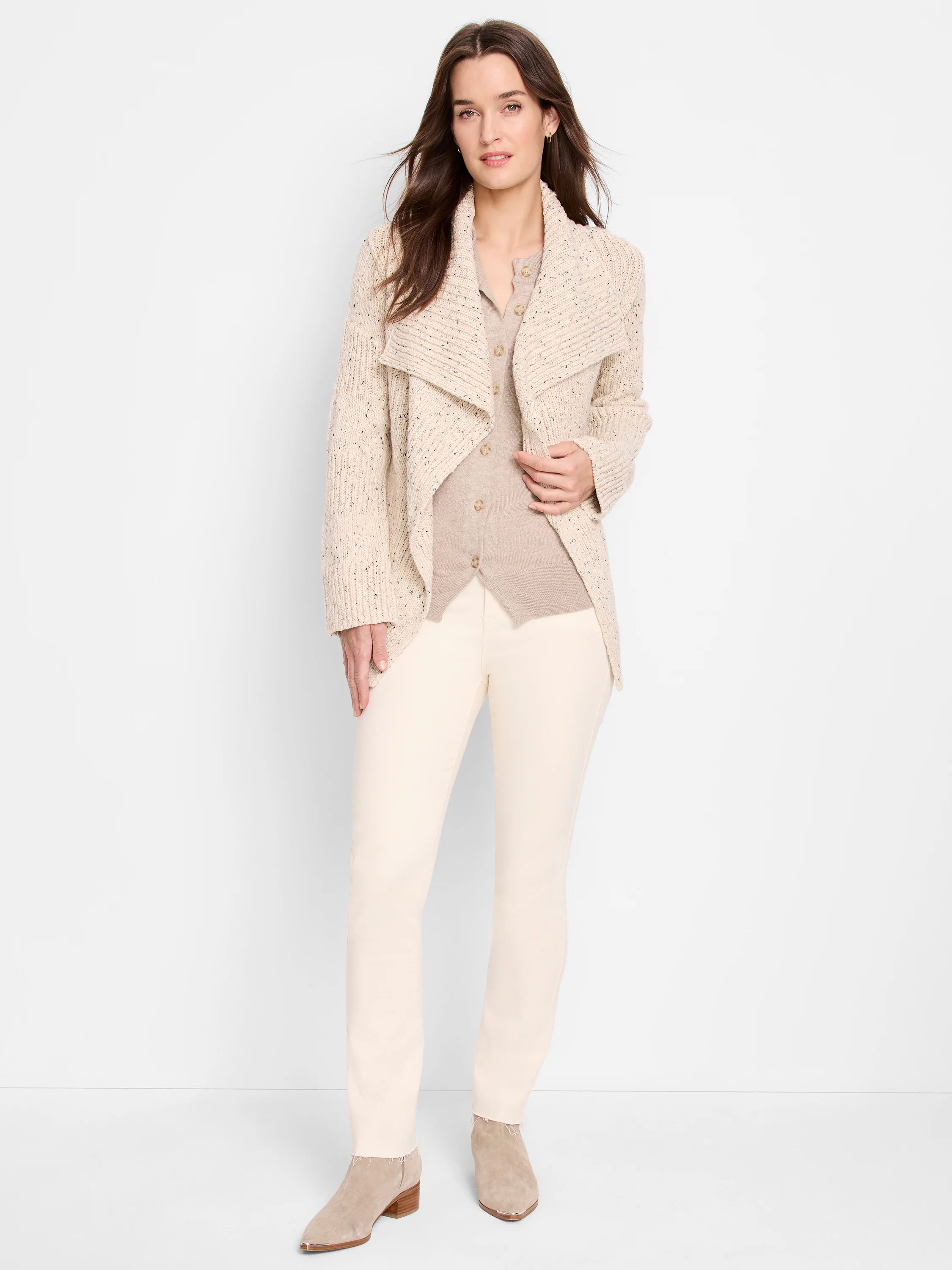Light beige tweed knit cardigan with dark flecks and a wide, ribbed shawl collar, worn open.