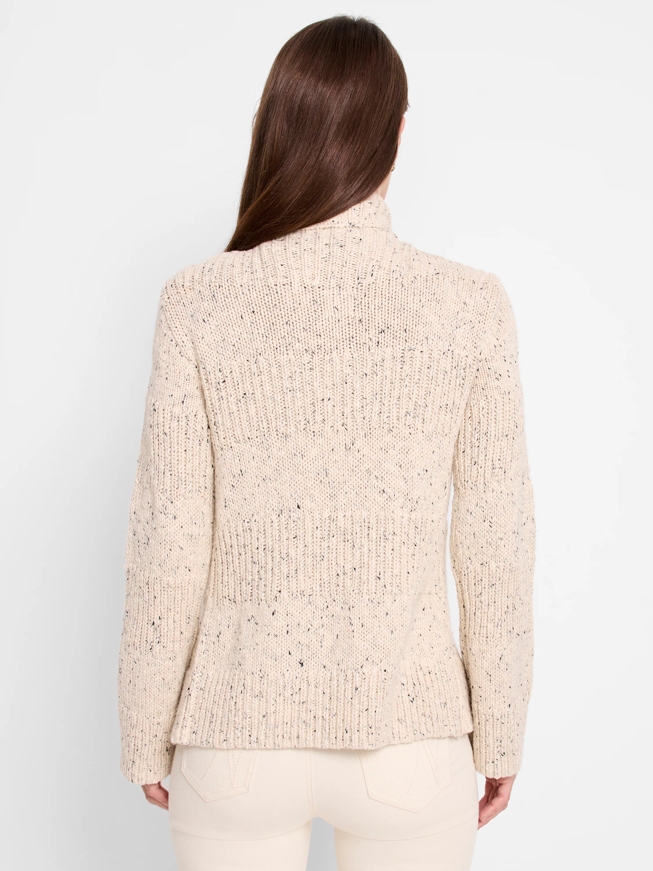 Cream tweed knit cardigan with dark flecks. Ribbed high neck, cuffs & hem are visible from the back.