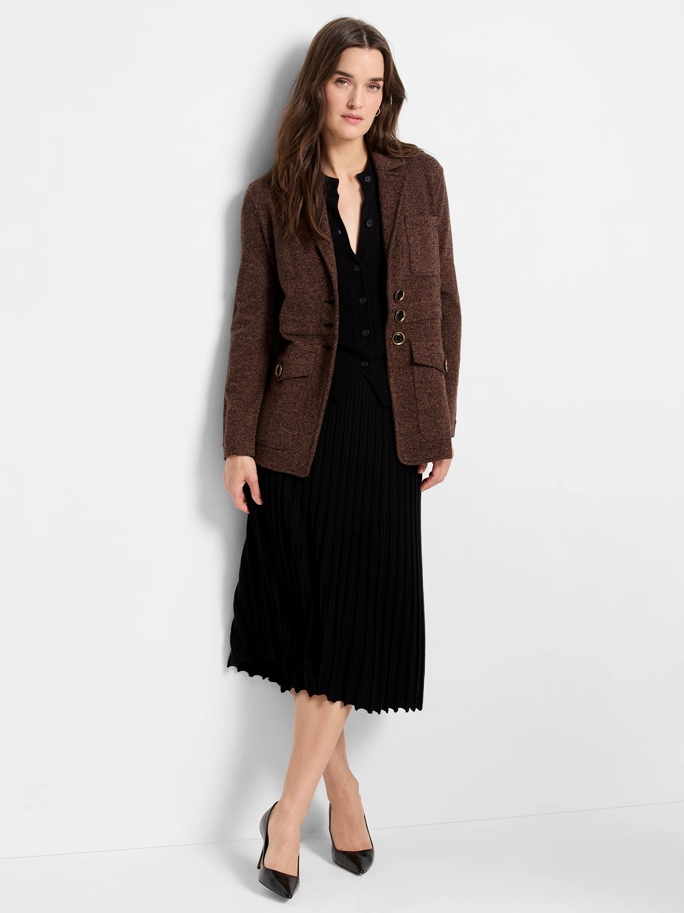 Brown knit blazer with textured finish, notched lapels, and gold-tone decorative buttons and pocket details.