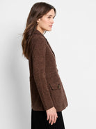 Editor Knit Blazer, heathered brown, with lapels and dark buttons featuring brass rims on flap pockets.