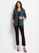 Heathered dark gray knit blazer with notched lapels, front buttons, and two flap pockets with brass details.