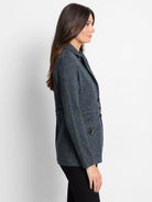 Charcoal blue knit blazer with notched lapels, long sleeves, and four brass buttons.