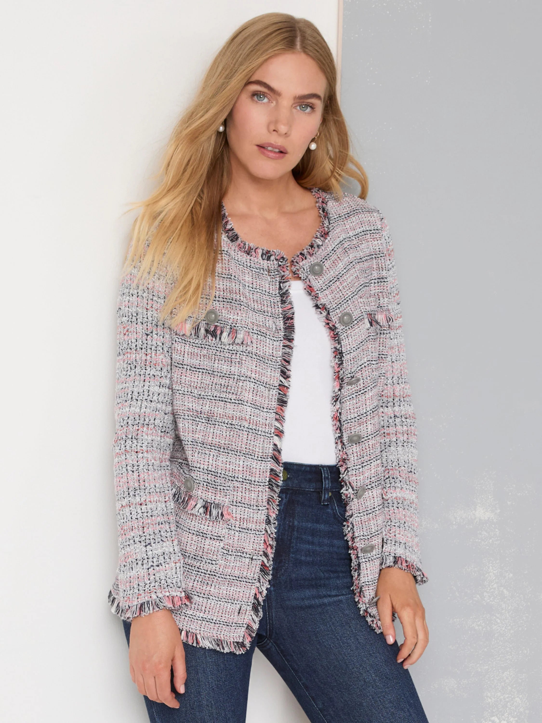 Pink, grey, and black mixed knit jacket with fringe trim, collarless design, and decorative buttons.