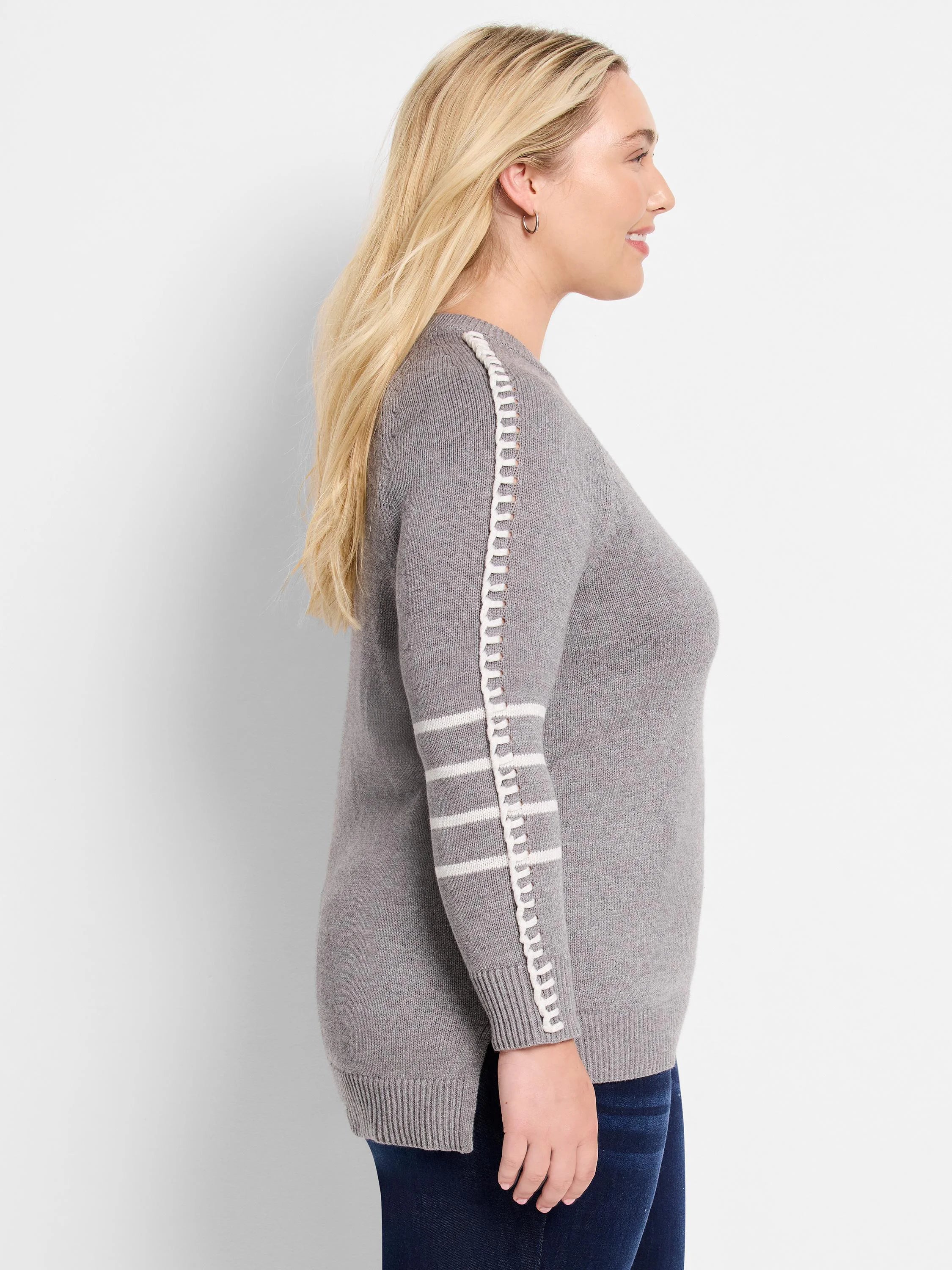 Grey sweater with white vertical trim and three white stripes on the sleeve. Ribbed cuffs & hem.