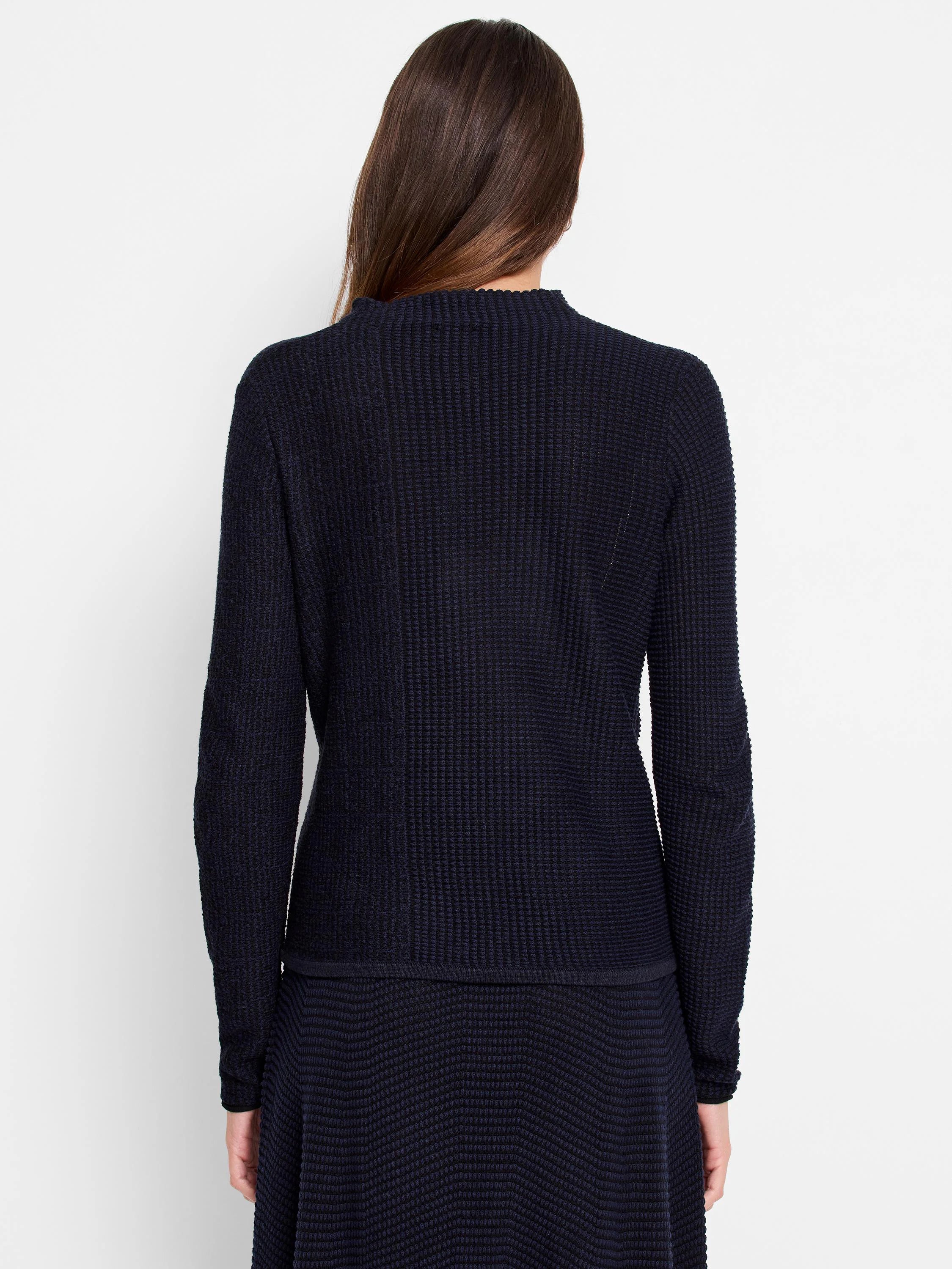 Dark navy blue, long-sleeved, textured knit sweater. The texture is a waffle or honeycomb pattern.