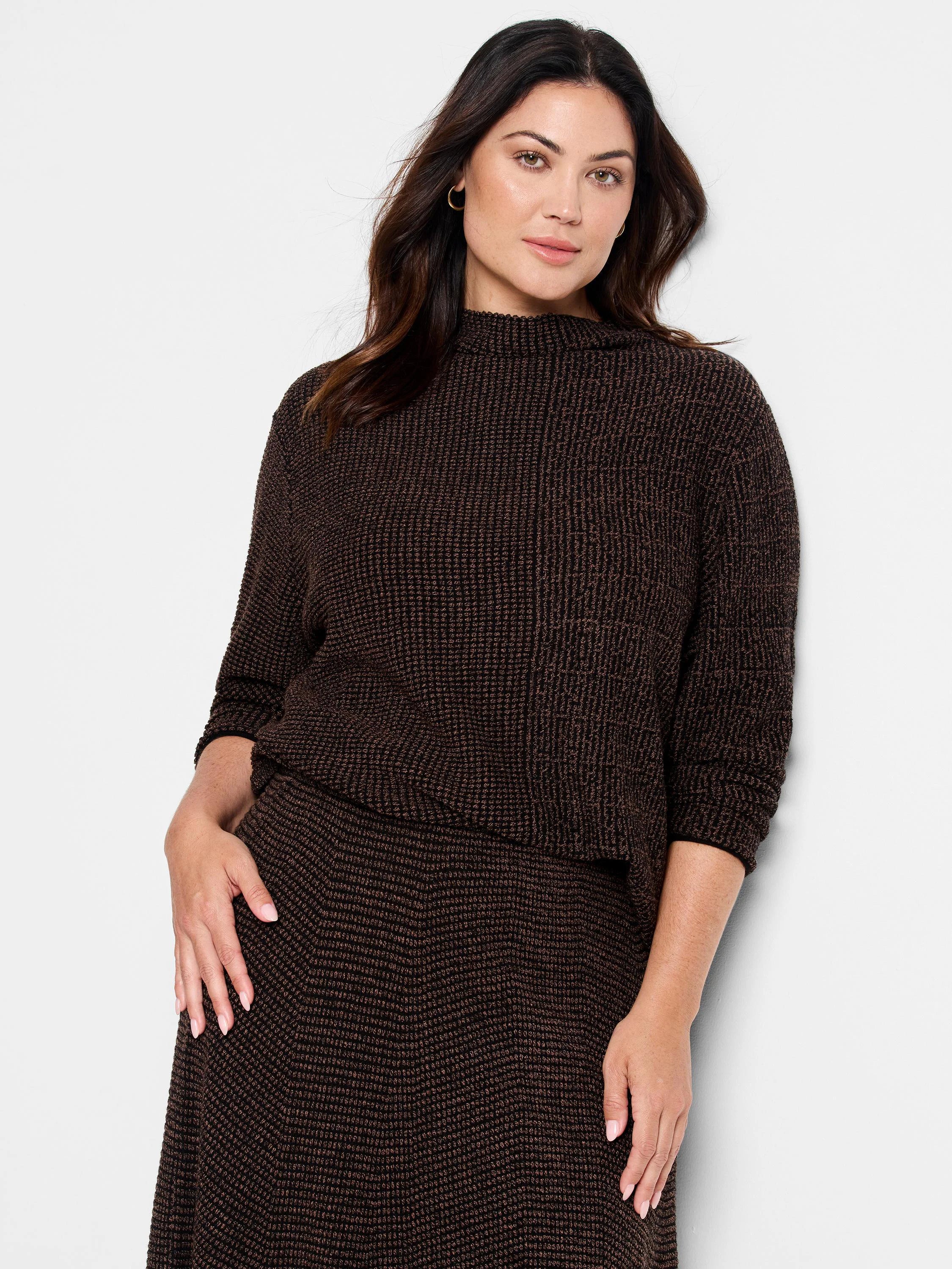 Dark brown pixel knit sweater with lighter brown flecks, mock neck, and 3/4 sleeves.