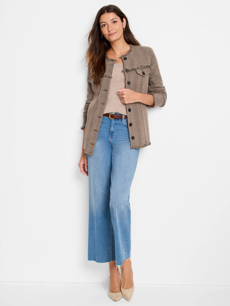 Brown tweed knit jacket with fringe trim on edges and pockets, and dark buttons.