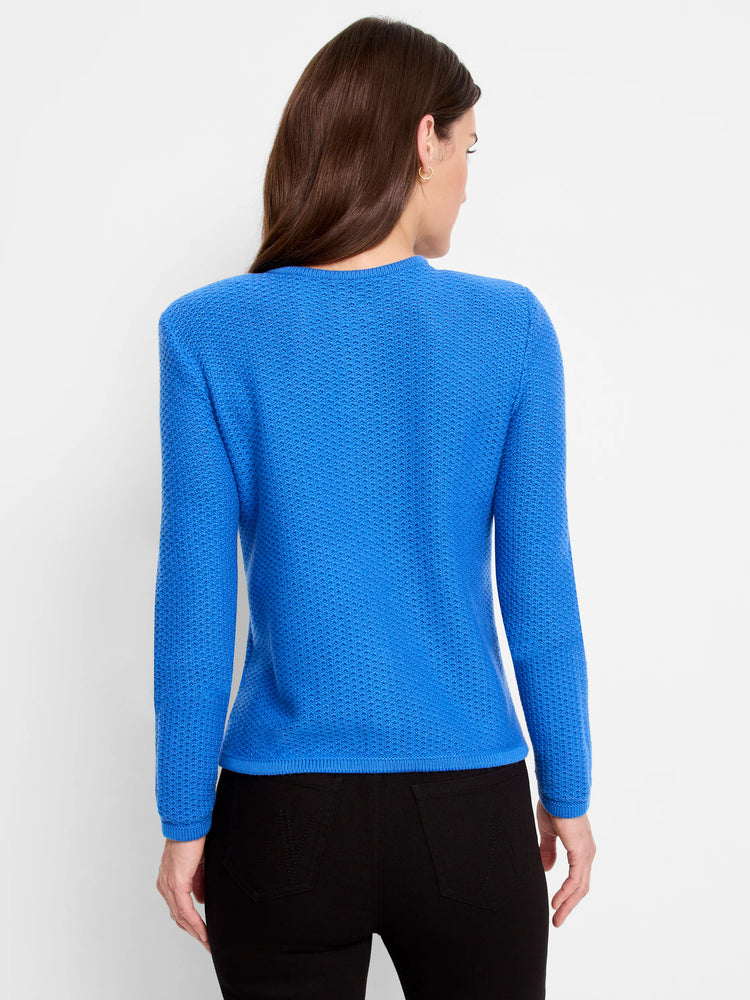 Here's alt text for the image, under 125 characters:
"Back view of a bright blue, textured knit sweater jacket. The...