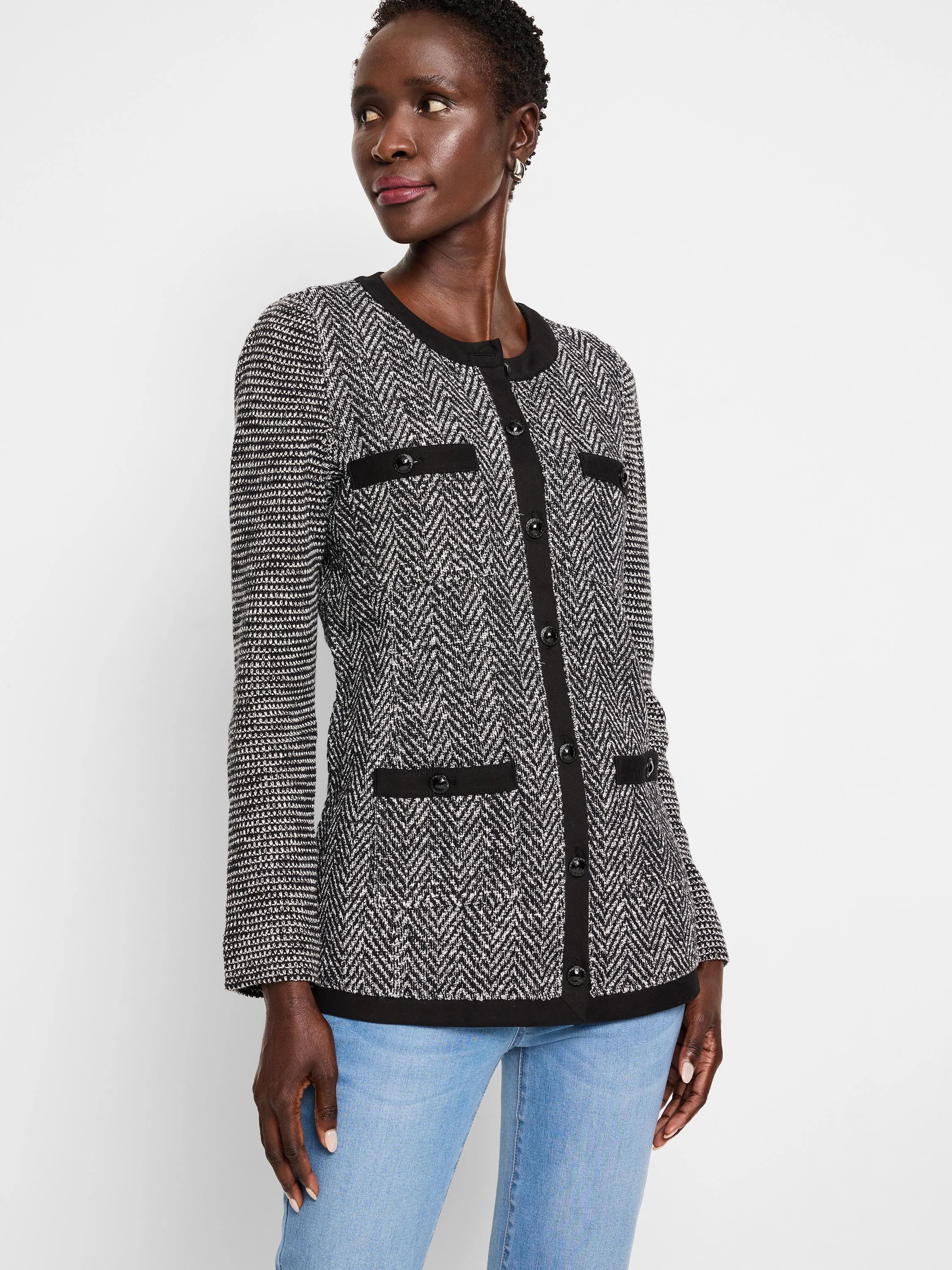 Black & white herringbone knit jacket with black buttons and trim. Long sleeves.
