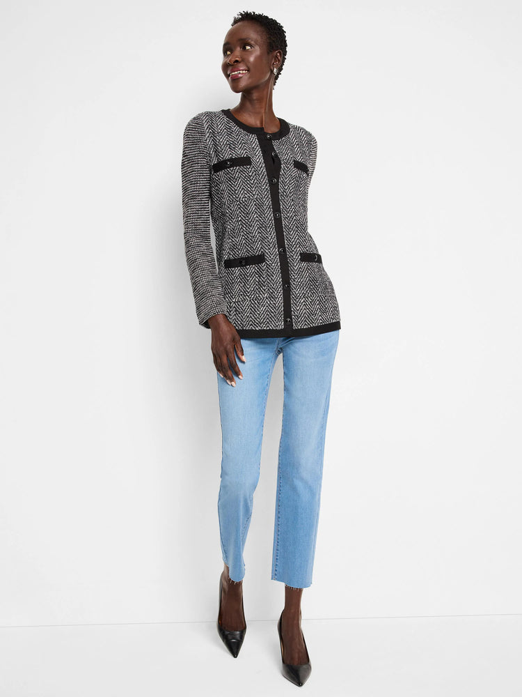 Black and white herringbone knit jacket with black buttons and trim. Front pockets.