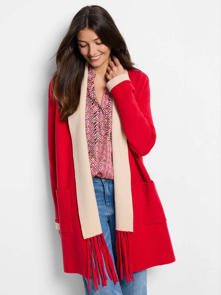 Red jacket with cream-colored interior and red fringe. Open front, hip length, patch pockets.