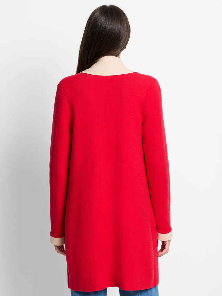 Red jacket, beige collar and cuffs. Long sleeves. Reverse side not shown.