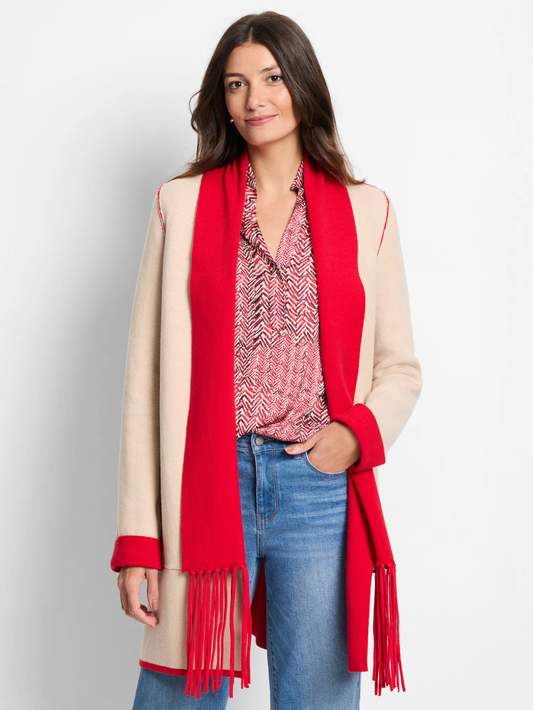 Beige and red reversible jacket. Red side features long fringe. Red trim details.