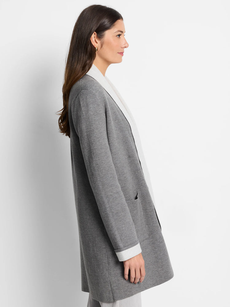Gray reversible jacket with off-white interior. Features long sleeves and pockets.