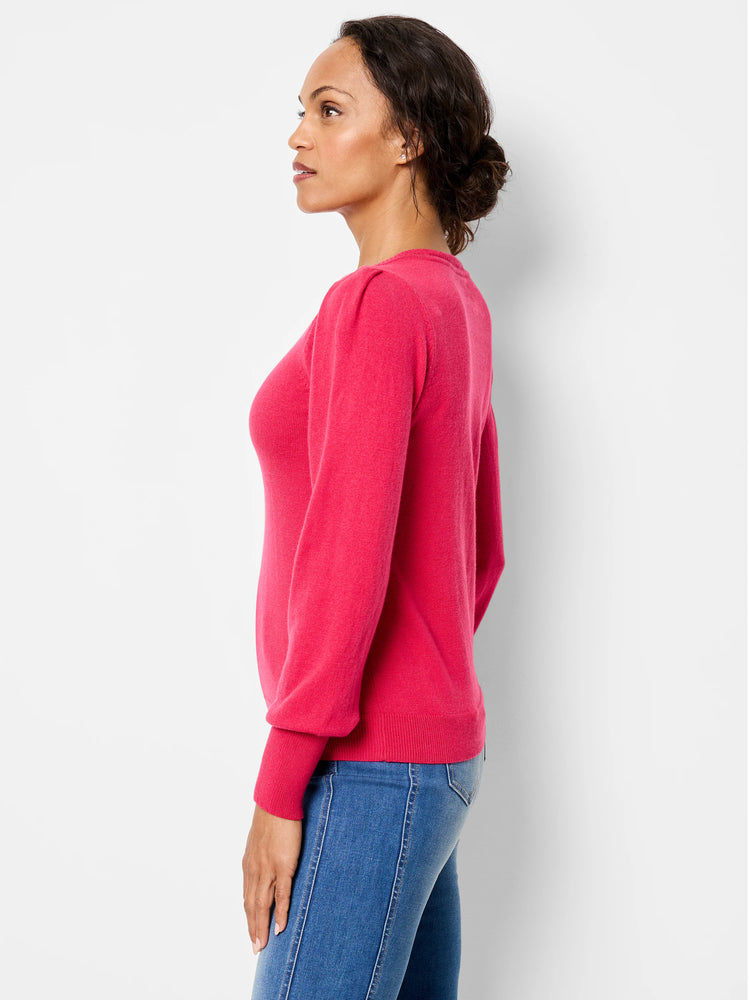 Bright pink sweater featuring gathered puff sleeves, a crew neck, and ribbed cuffs/hem, worn by a model.