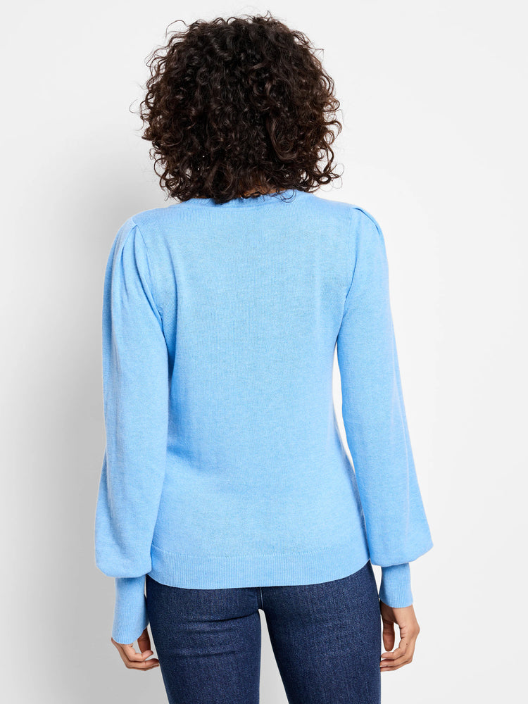 Light blue knit sweater with puffed sleeves, ribbed cuffs.