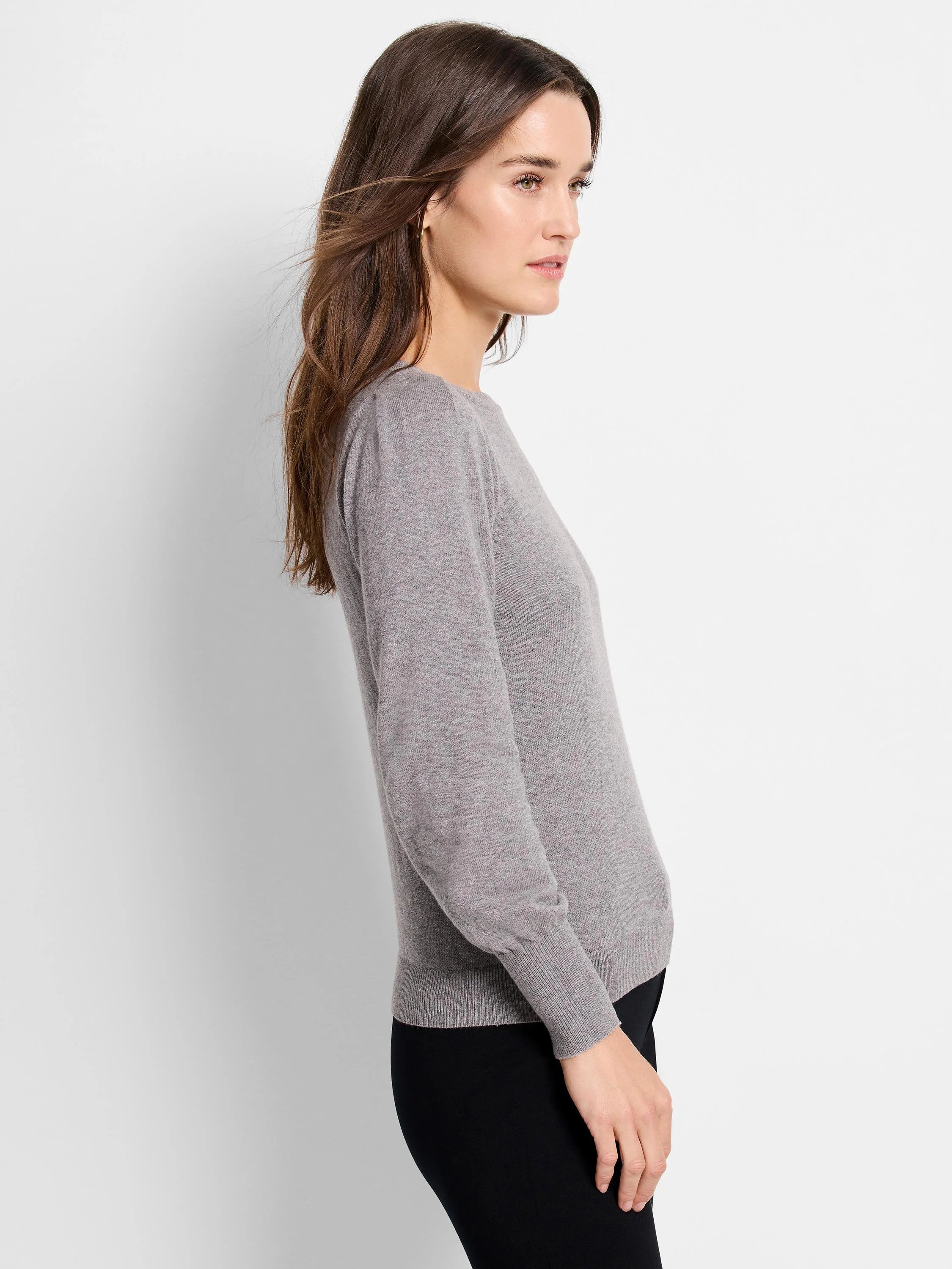 Grey crew neck sweater with long sleeves, ribbed cuffs and hem.